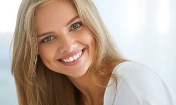 Image Text: Woman with blonde hair smiling