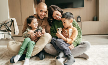 Image Text: smiling Asian family, family oral health, oral health and family, busy parents, busy family