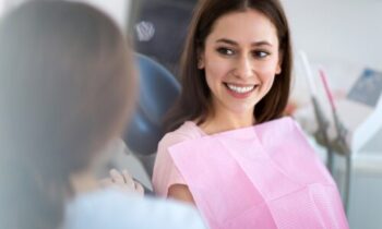 Image Text: woman in dental chair, tooth extraction preparation