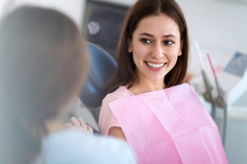 Image Text: woman in dental chair, tooth extraction preparation