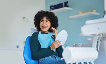 Image Text: woman happy after cosmetic smile makeover